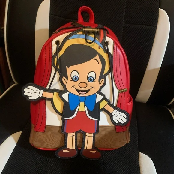 Pinocchio loungefly backpack with moving arms and matching loungefly wallet - Picture 1 of 16